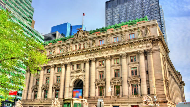 The Alexander Hamilton U.S. Custom House building with other buildings around it.
