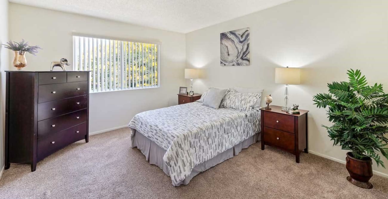 Spacious bedroom with carpet at The Enclave in Studio City, California