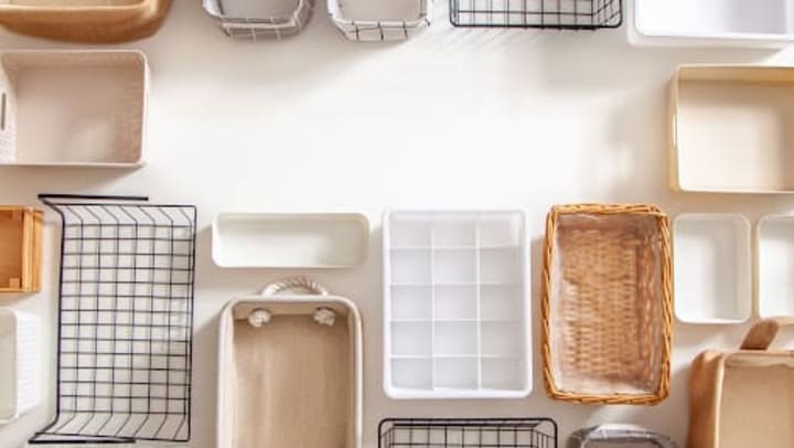 Top view of closet organization boxes and steel wire baskets in different shapes.