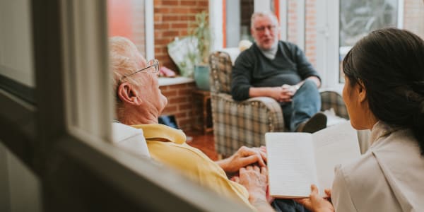 Bible study session led by a caretaker at Wellington Place at Fort Atkinson in Fort Atkinson, Wisconsin