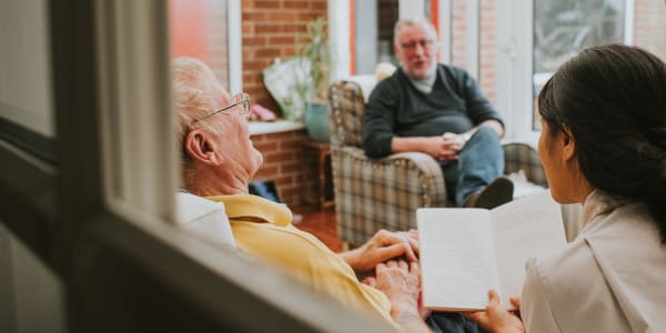 Bible study session led by a caretaker at Villas At Maple Ridge in Spooner, Wisconsin
