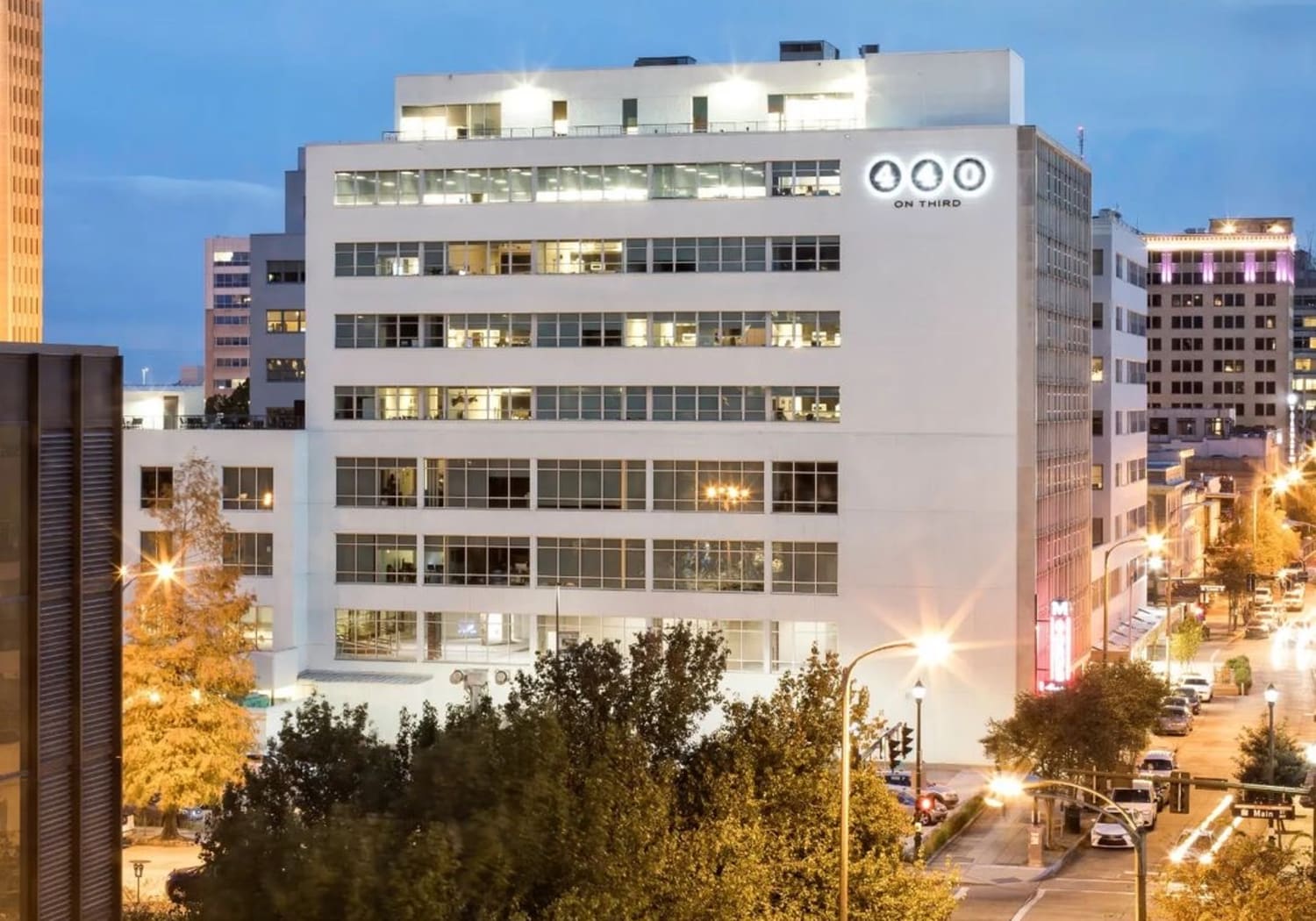 Property exterior in the night at 440 on Third Apartments in Baton Rouge, Louisiana