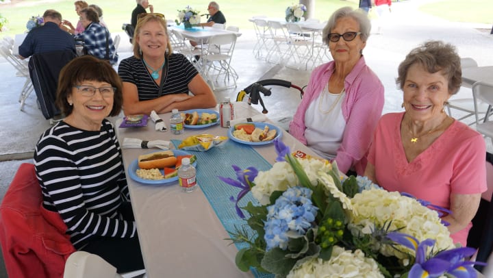 Merrill Gardens residents enjoying a picnic together in Kirkland, WA