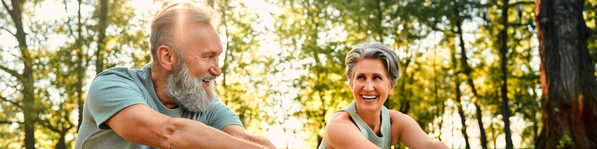 Resident couple doing yoga in park near Neighborhood | 570 Washington in New York, New York