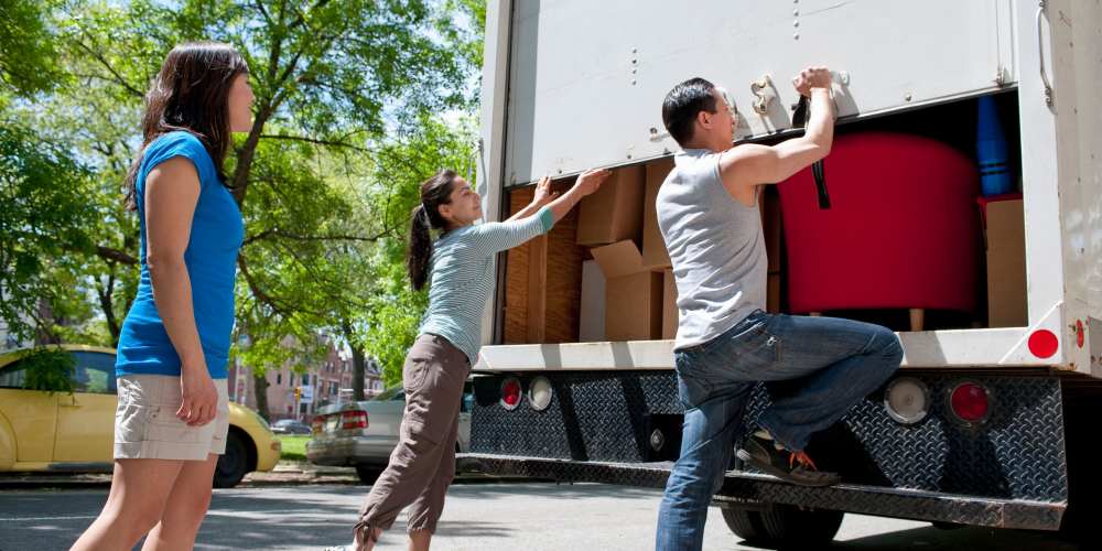 A family loading up a rental moving truck from Stayton Mini Storage in Stayton, Oregon