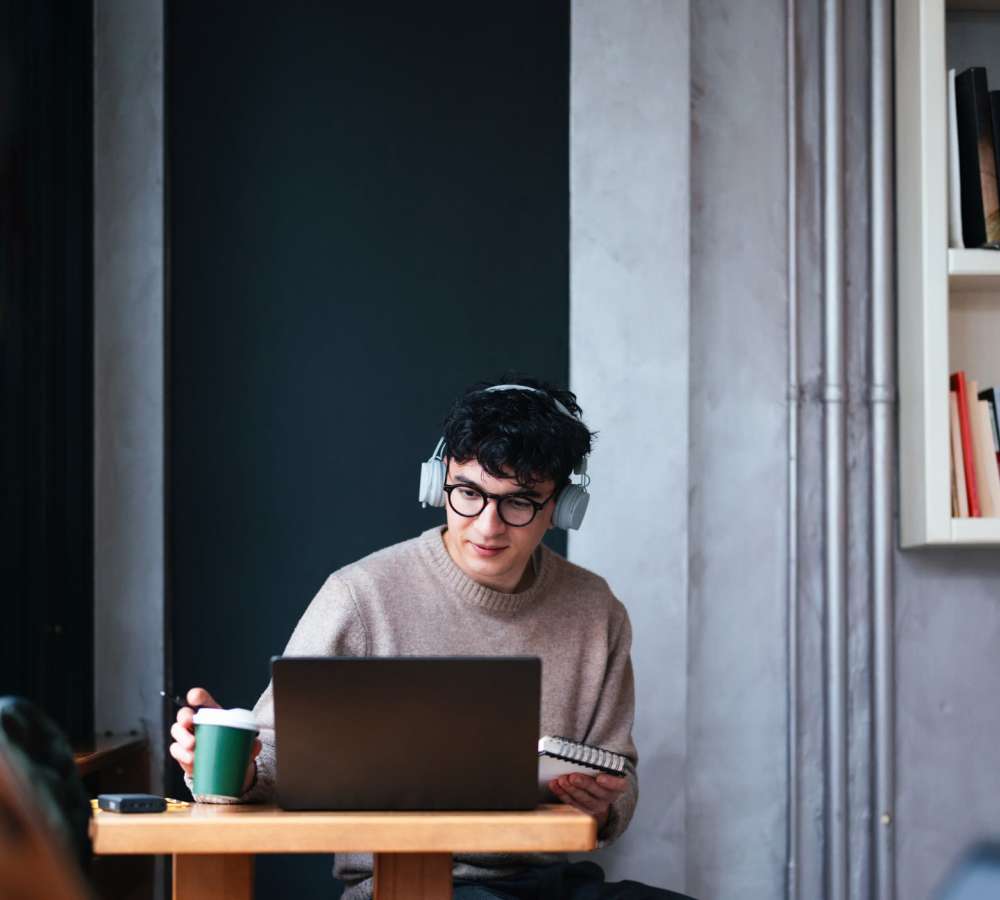 Student resident working on a laptop at Titan Court in Eugene, Oregon