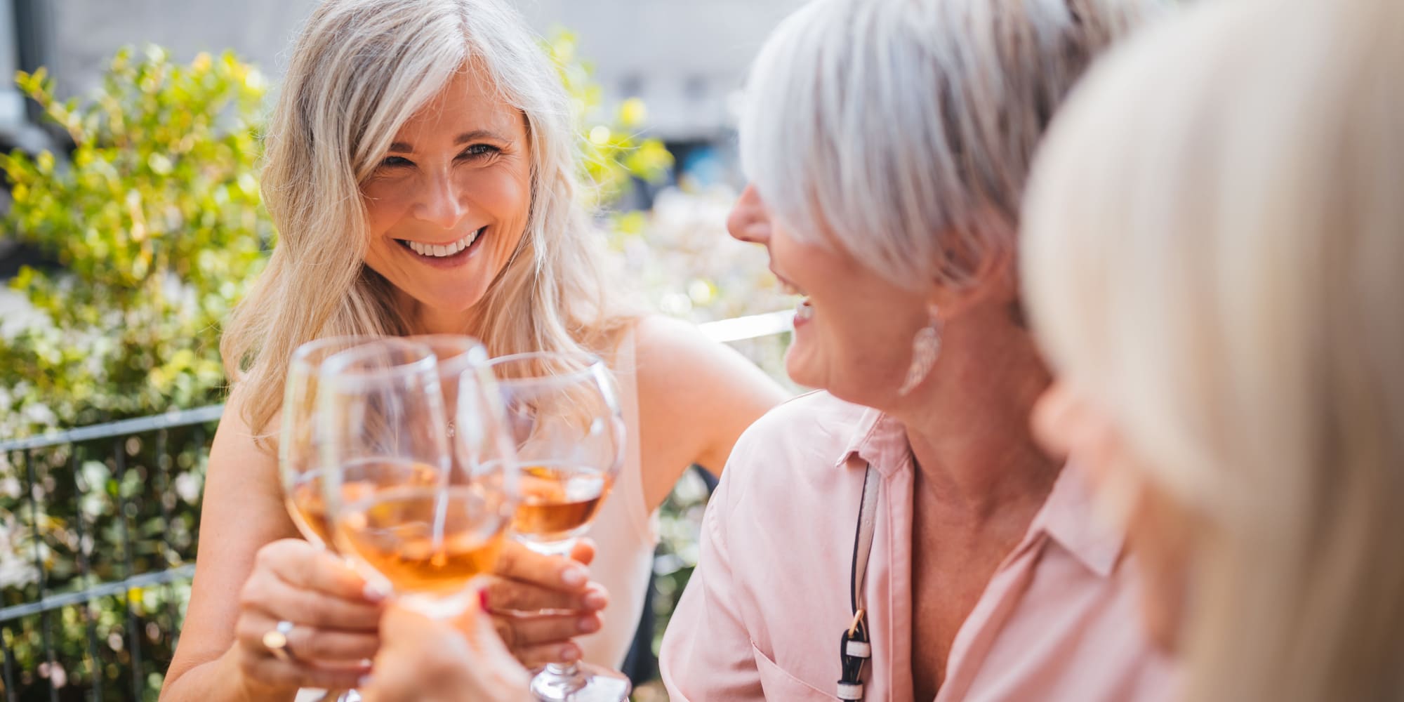 Group of women enjoying a glass of wine together at The Pointe at Siena Ridge in Davenport, Florida