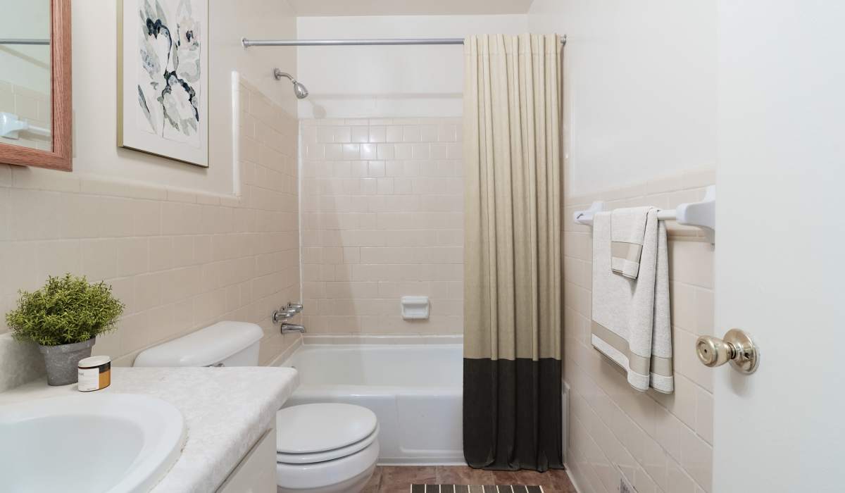 Bathroom with shower curtain at Landmark at Patterson in Richmond, Virginia