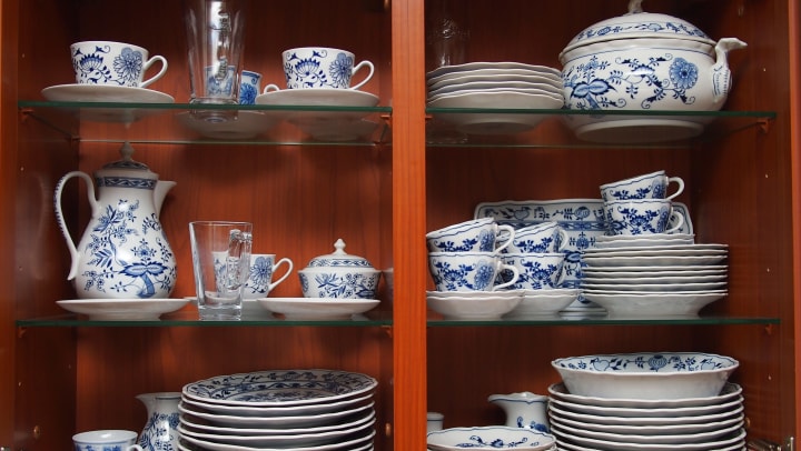 China dishware sitting on shelves.