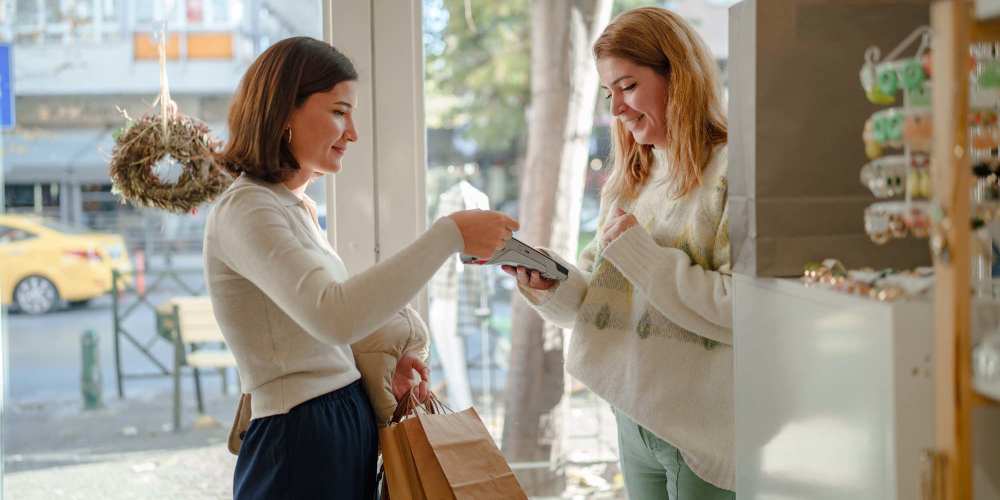 Woman paying for her clothes in a shop near Villas at Marlin Bay in Clover, South Carolina