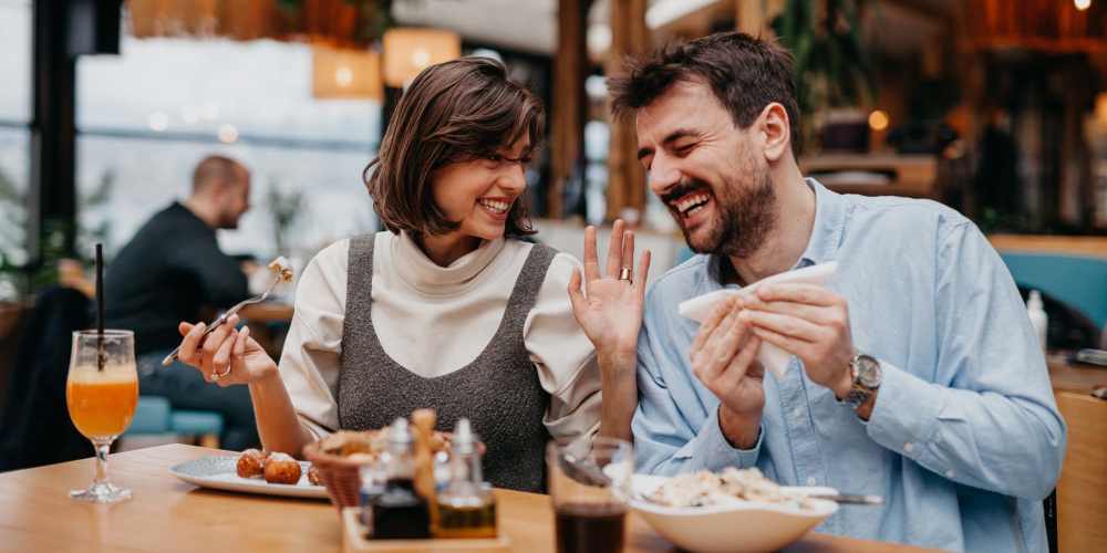 A lovely couple having a good time in a restaurant near West Edge in Lynchburg, Virginia