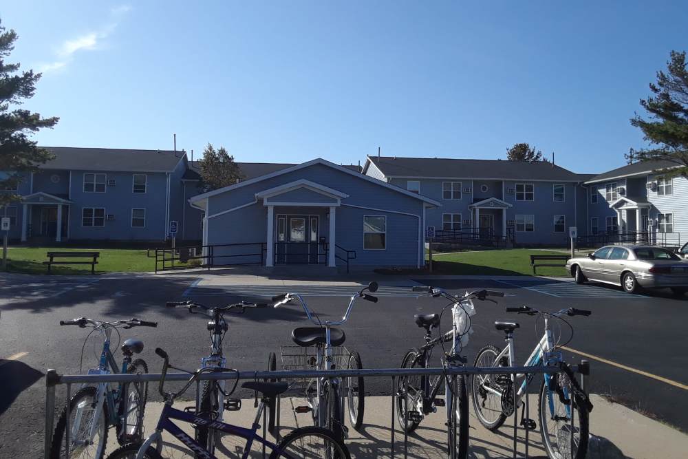 Exterior view of the apartments with bicycles racks at Manistique Lakeview in Manistique, Michigan