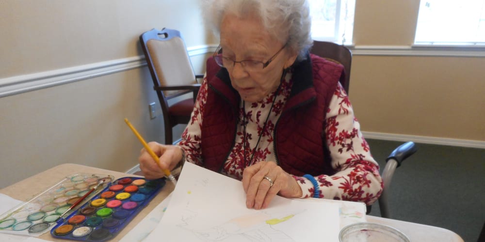 A resident making an art project at Patriots Glen in Bellevue, Washington. 