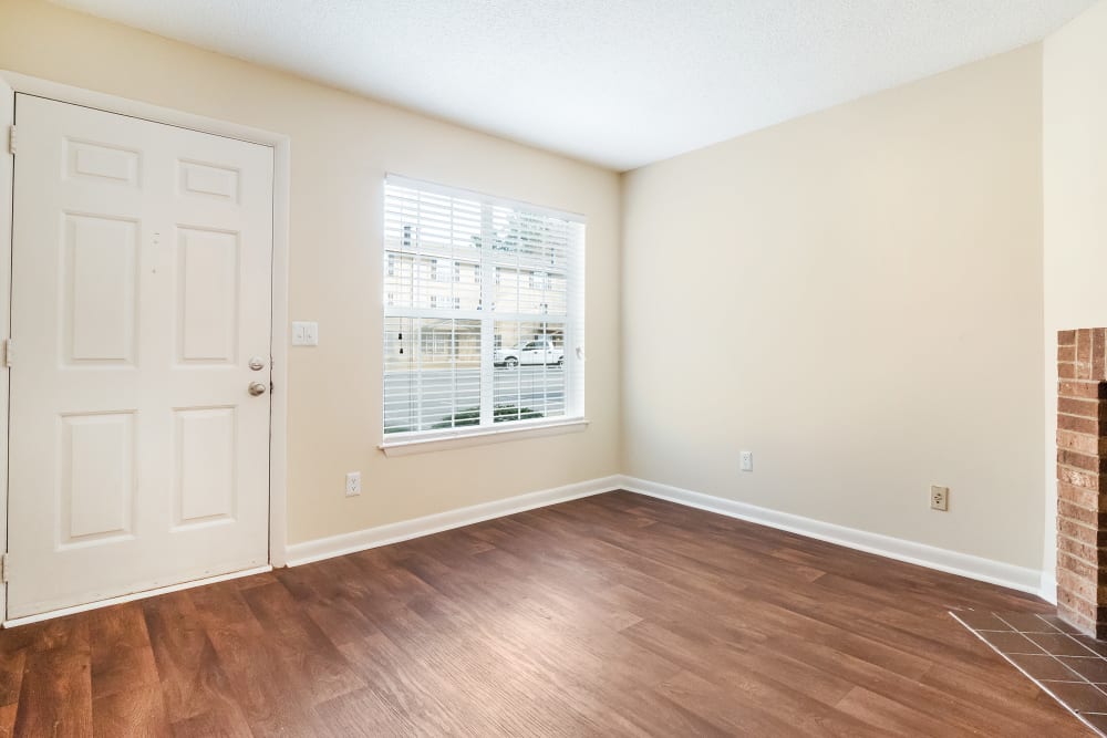 View of living room featuring wood flooring at Patrician Terrace Apartment Homes in Jackson, Tennessee