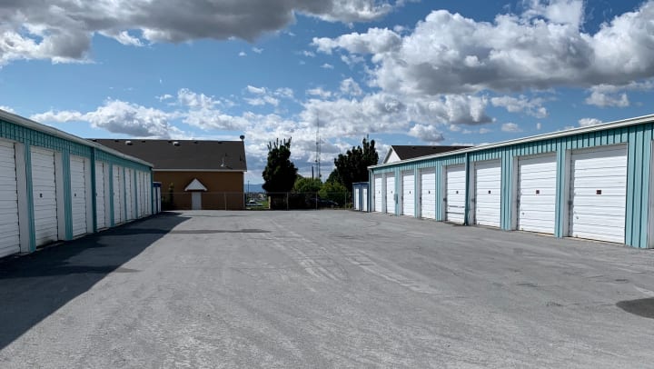 blue storage units in a parking lot