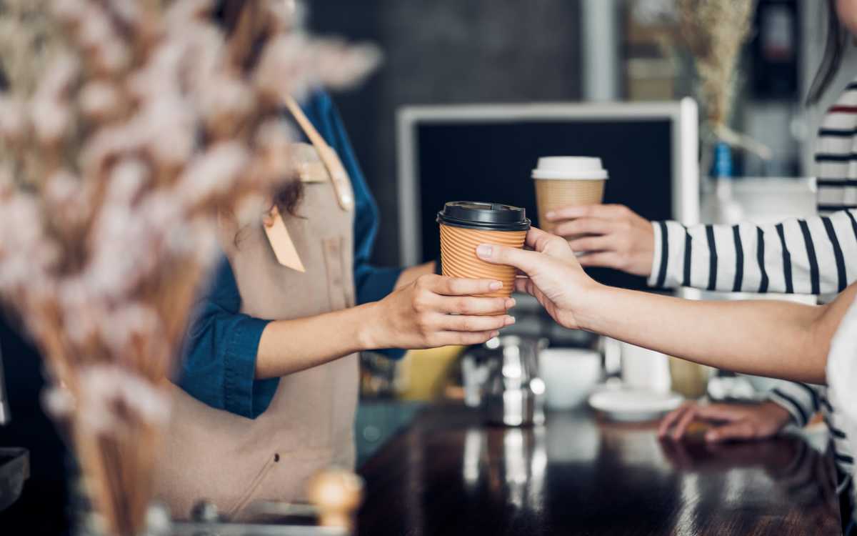 Residents having coffee at a café near The Rose on Colfax in Denver, Colorado