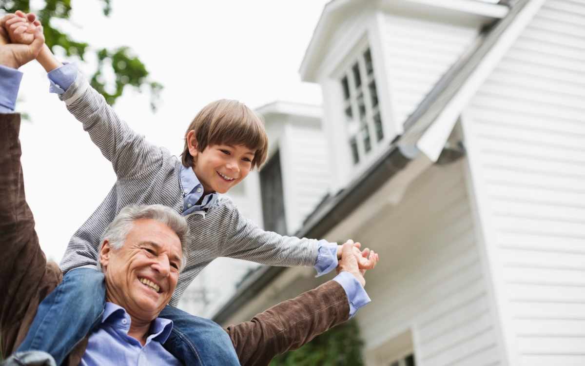 Happy resident with his grandson at Carlton Arms Of St. Petersburg in St Petersburg, Florida