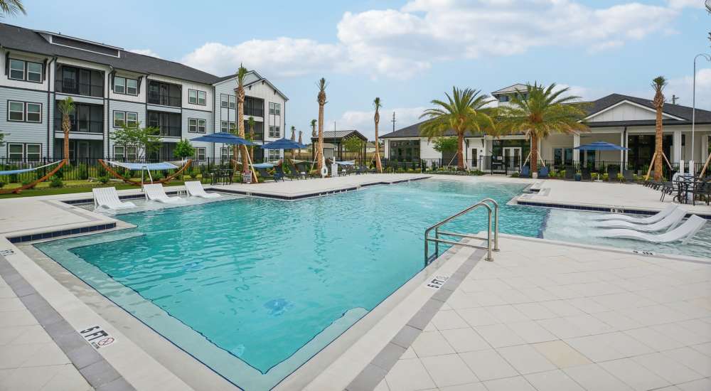 The community swimming pool with water features at Novo Westlake in Jacksonville, Florida