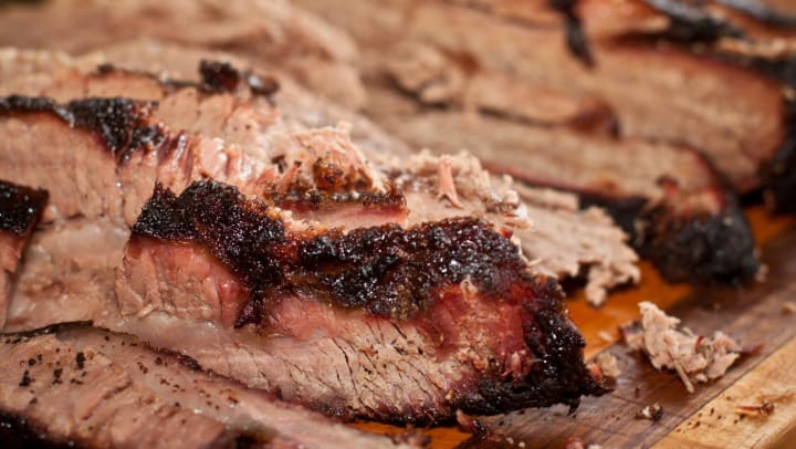 Close-up of brisket on a wooden tray