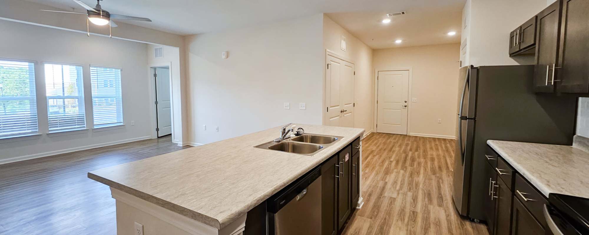 Open floor plan with kitchen island and dining area at Bridge Creek Pointe in Spartanburg, SC