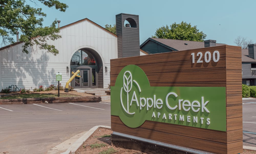 Clubhouse and signage at Apple Creek Apartments in Stillwater, Oklahoma