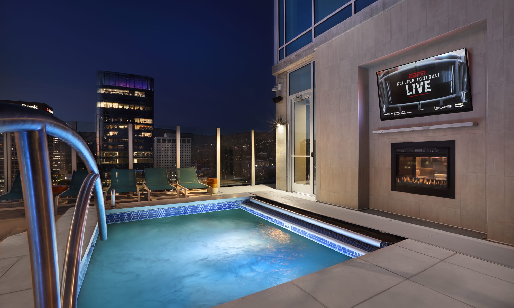 Spa with television and fireplace in the evening at Luxury high-rise community of Liberty SKY in Salt Lake City, Utah