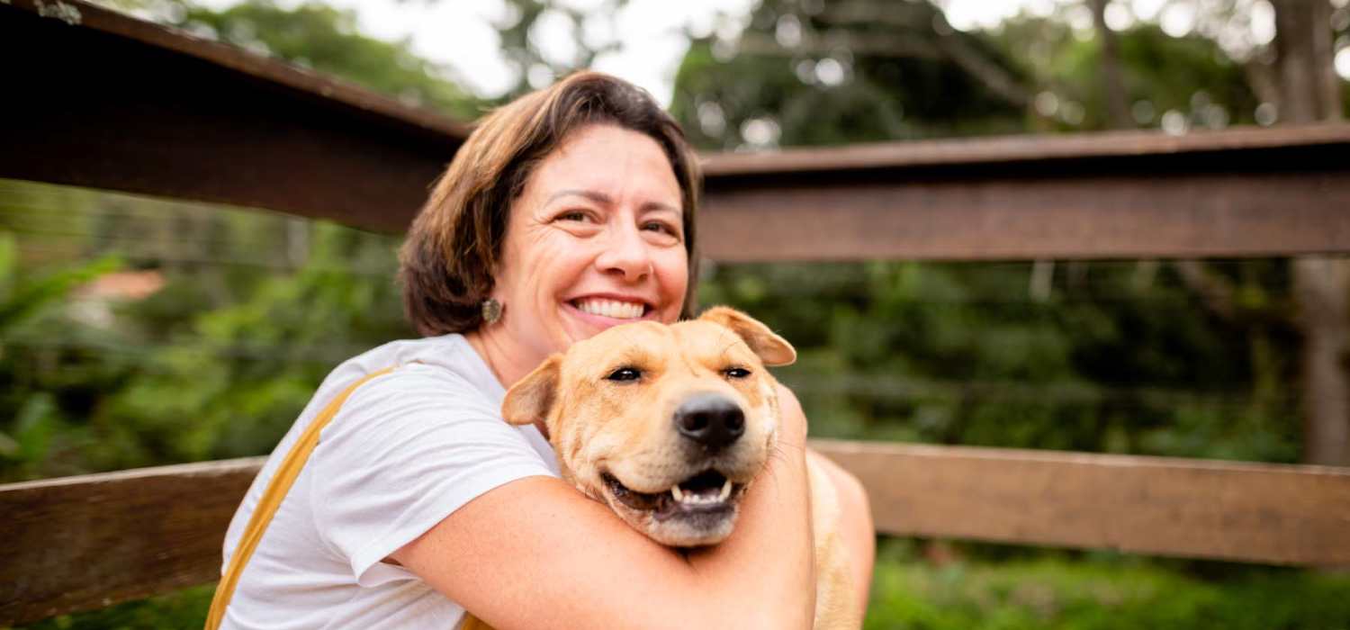 Woman holding her dog at The Lofts At Union Crossing in Gastonia, North Carolina