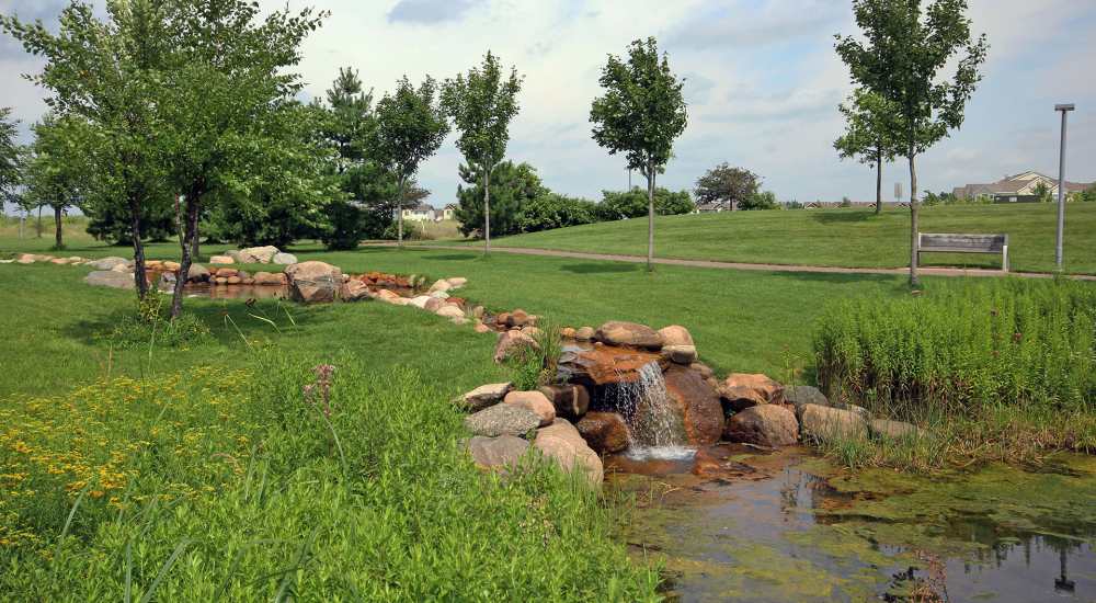 Waterbody with grass landscape near Parkview East in Ramsey, Minnesota
