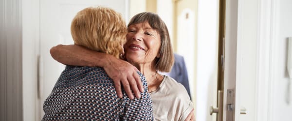 Residents hugging at Lake Forest at Swift Creek in Midlothian, Virginia