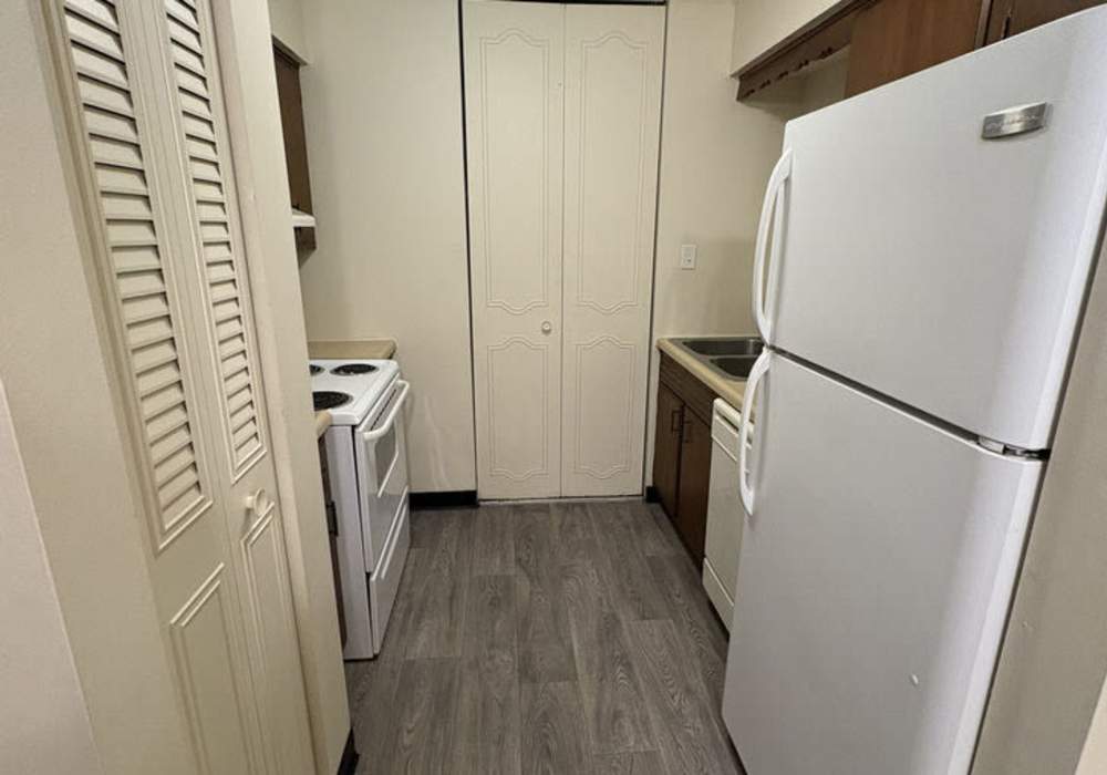 Kitchen with modern appliances at Mount Vernon Arms Apartments in Merrillville, Indiana