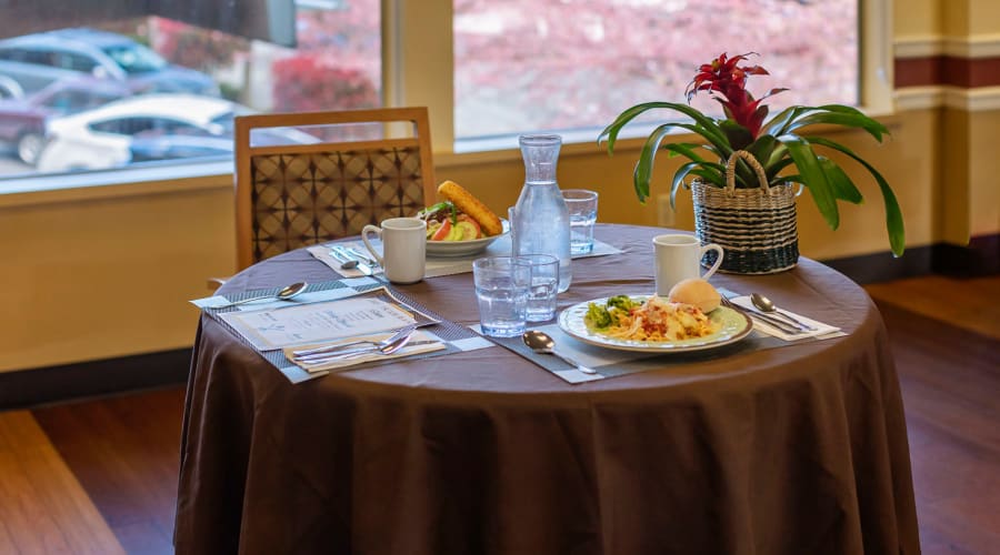Table set with two meals ready for residents at Cascade Park Vista Assisted Living in Tacoma, Washington