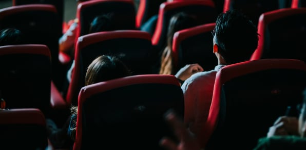 Residents watching movie in the theatre near Cherokee Summit Apartments in Acworth, Georgia