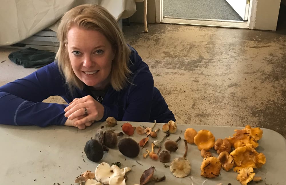 Kendra from Touchmark Central Office in Beaverton, Oregon with the mushrooms she collected