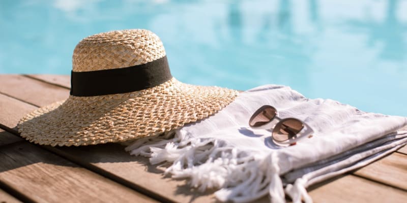 a hat and sunglasses by the pool at Marine Palms in Twentynine Palms, California