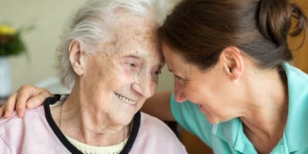 Resident and caregiver at Maple Ridge Care Center in Spooner, Wisconsin