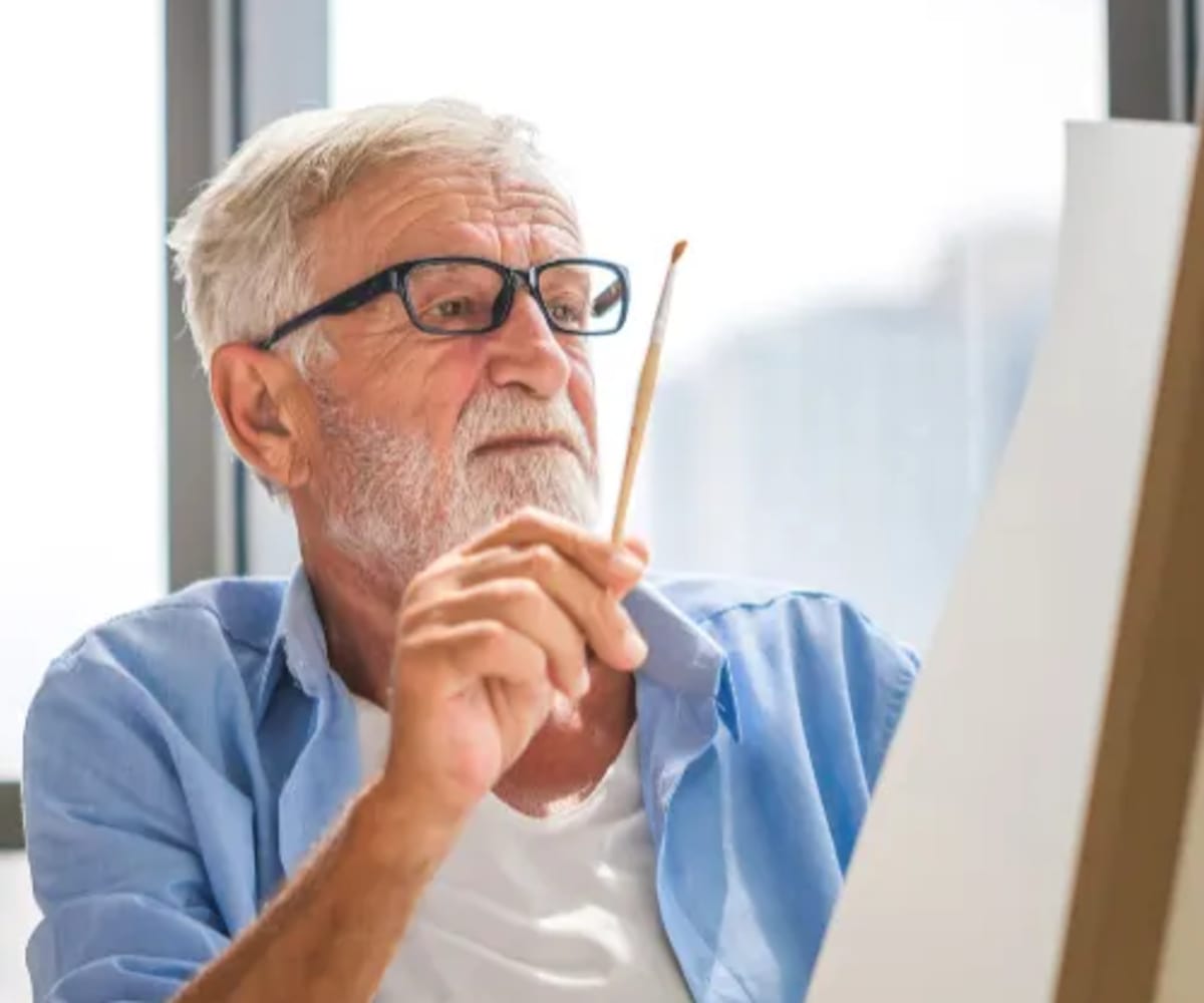 Man Painting at King City Senior Village in King City, Oregon