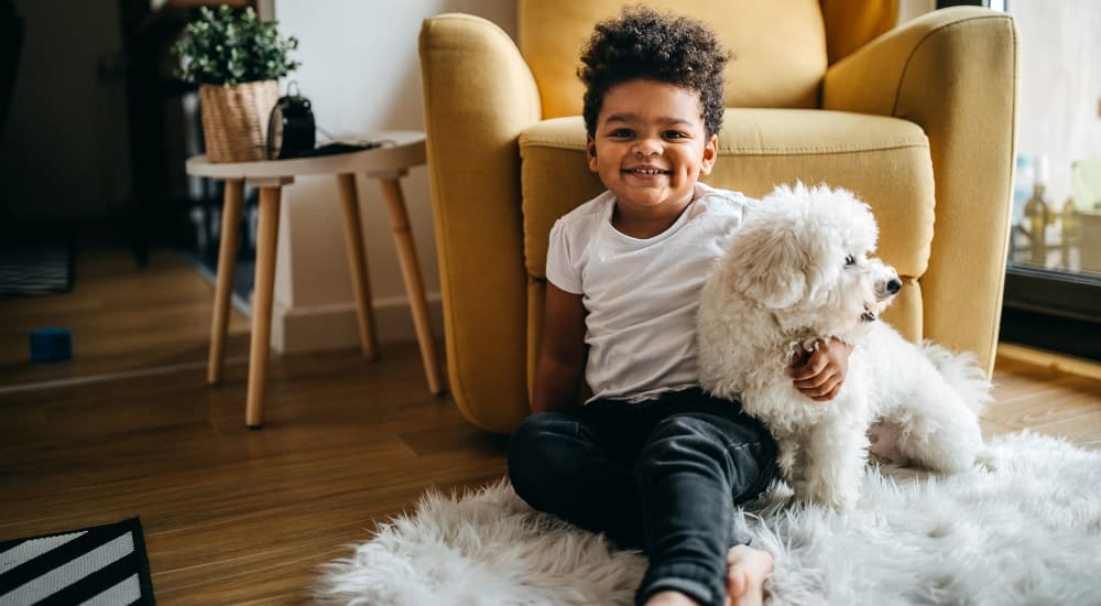 Boy with his dog at Courtyard Apartments in Stockton, California