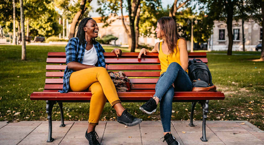Residents having a chat on a park bench near The Millwright in Cornelius, North Carolina