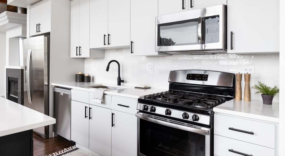 Modern kitchen with energy-efficient appliances at Aven Residences in Houston, Texas