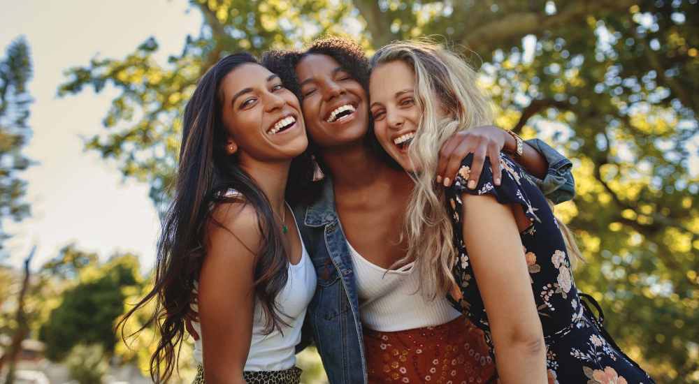 Resident women laughing in a neighborhood area near Adams Crossing in Waldorf, Maryland