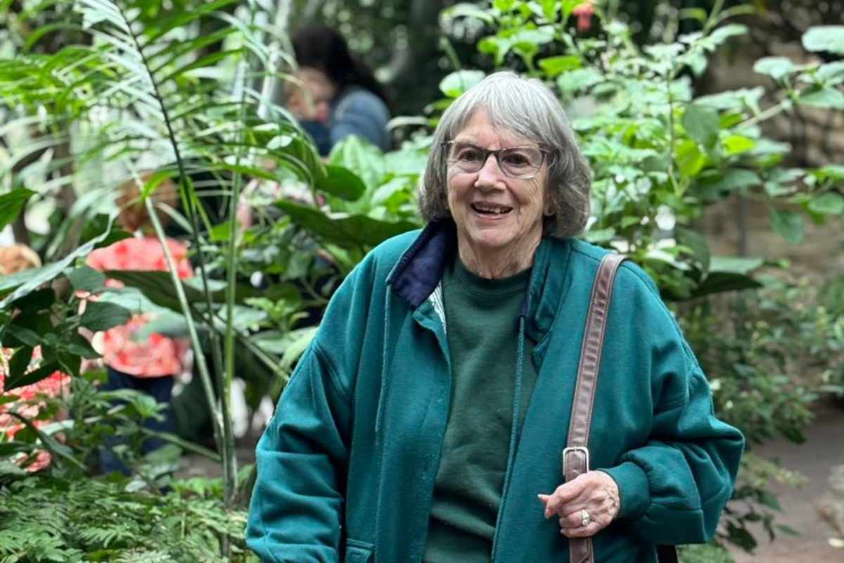 Resident enjoying garden walk Watercrest at Kingwood in Kingwood, Texas.