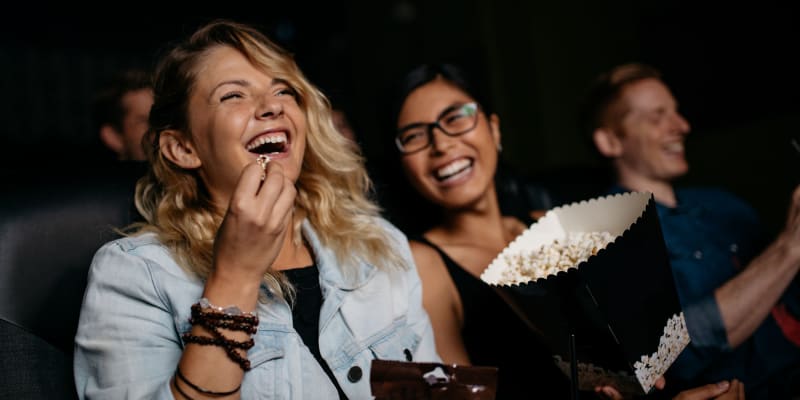 Residents eating popcorn at a movie theater near Harborview in Oceanside, California