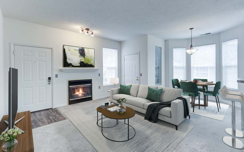 Model living room with carpeting at Hills of Aberdeen Apartment Homes in Valparaiso, Indiana