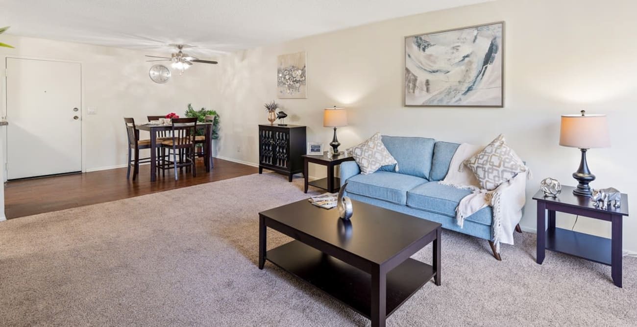 Spacious living room with carpet and hardwood floors at The Parkview in Lake Balboa, California