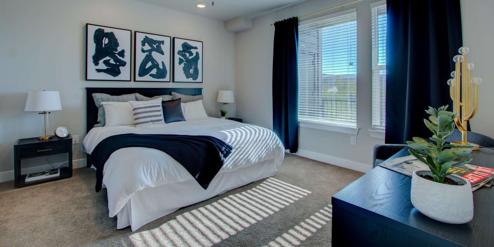 Bedroom with large windows at Fusion 355 in Broomfield, Colorado