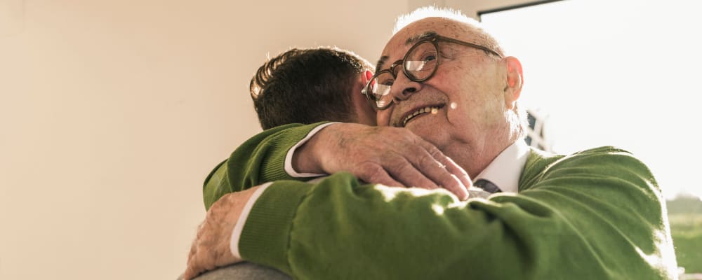 Two people hugging at The Vistas Assisted Living and Memory Care in Redding, California