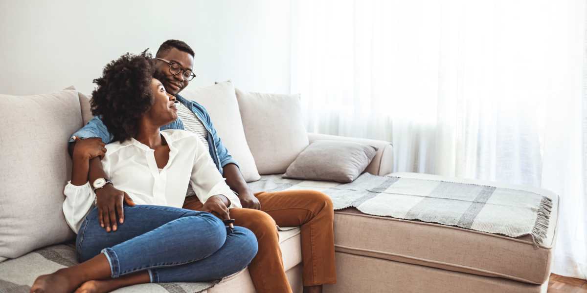 Couple enjoying time together at home at Blakey Apartments in Homestead, Florida