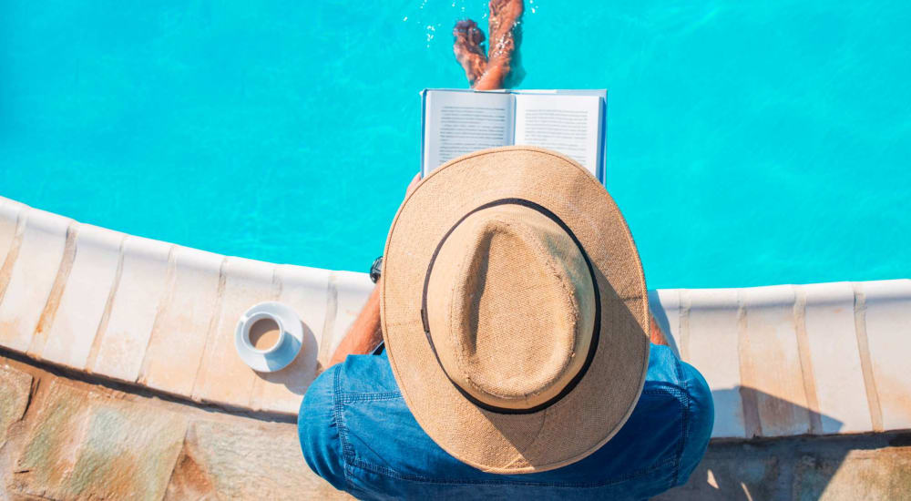 Residents out for a swim and reading a book at The Gibson in Houston, Texas