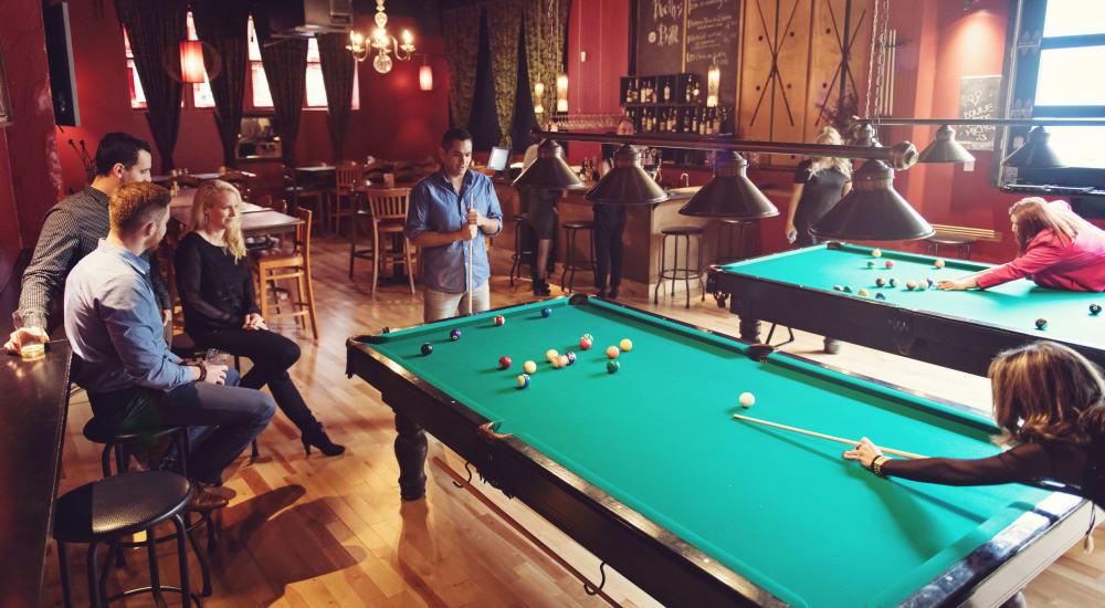 Residents hang out at the billiards table in the downtown area near The Parker at Ellington in Houston, Texas