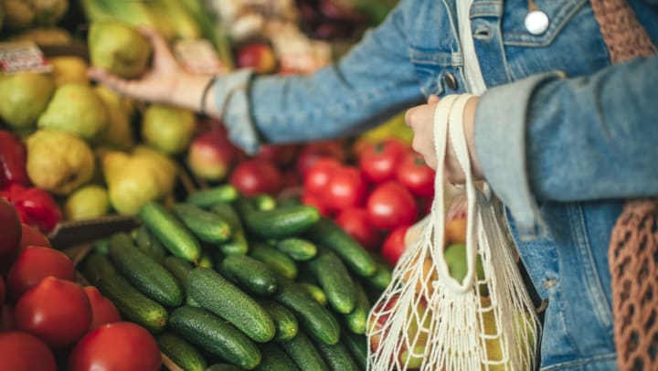 Resident shopping for groceries near Olympus at the District in South Jordan, Utah